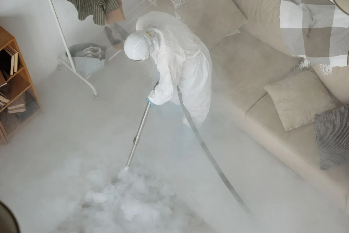 Biohazard cleanup technician in protective equipment, Ecorse, MI
